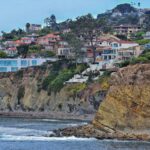 Coastal cliffs and hillside homes overlooking the ocean in San Diego, California.